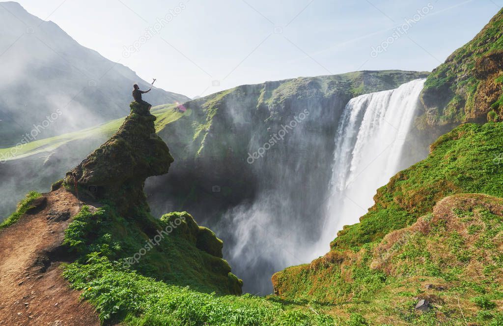 Great waterfall Skogafoss in south of Iceland near the town of Skogar. Dramatic and picturesque scene.
