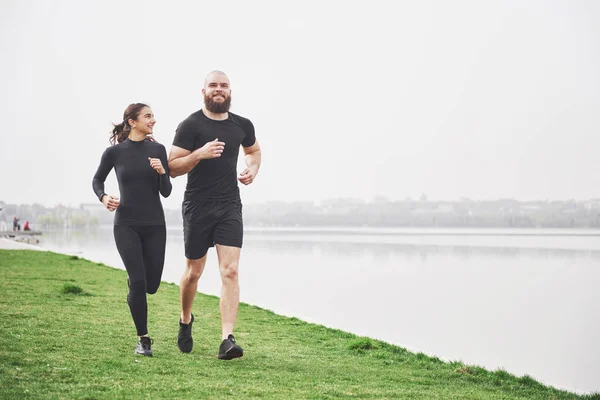 Couple Jogging Running Outdoors Park Water Young Bearded Man Woman — Stok fotoğraf