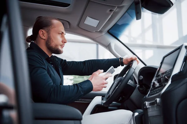 Satisfied Young Business Man Looking Mobile Phone While Driving Car — Stock Photo, Image