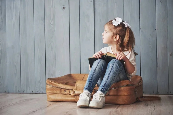 Ready Big Travel Happy Little Girl Reading Interesting Book Carrying — Stock Photo, Image