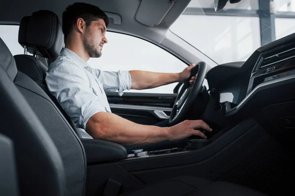 Young Man Sits Newly Bought Car Holding His Hands Rudder — Stock Photo, Image