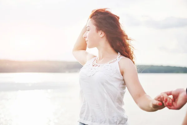 Attractive playful woman outdoors. Good summer day.