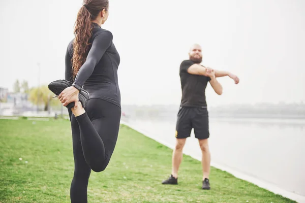 Fitness Couple Stretching Outdoors Park Water Young Bearded Man Woman — Stock Photo, Image
