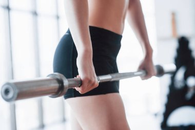 Woman lifting weights in gym Concept workout healthy lifestyle sport.