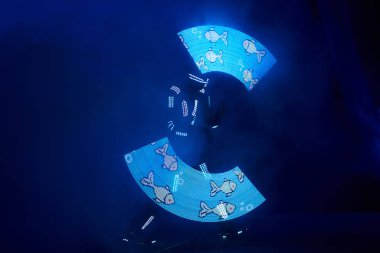 Laser show performance, dancers in led suits with LED lamp, very beautiful night club performance, party.