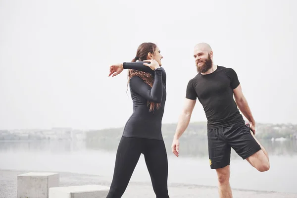 Fitness Couple Stretching Outdoors Park Water Young Bearded Man Woman — 图库照片