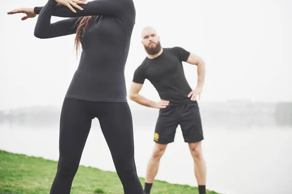 Fitness Couple Stretching Outdoors Park Water Young Bearded Man Woman — 图库照片