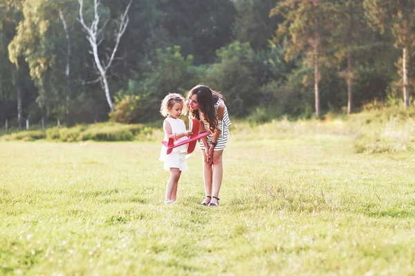 Child Talking Airplane Toy Her Hands Mother Outdoor — Stock Photo, Image