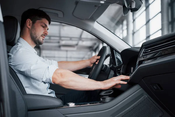 Young Man Sits Newly Bought Car Holding His Hands Rudder — Stock Photo, Image