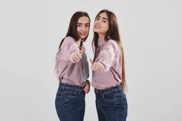 Thumbs Two Sisters Twins Standing Posing Studio White Background — 스톡 사진