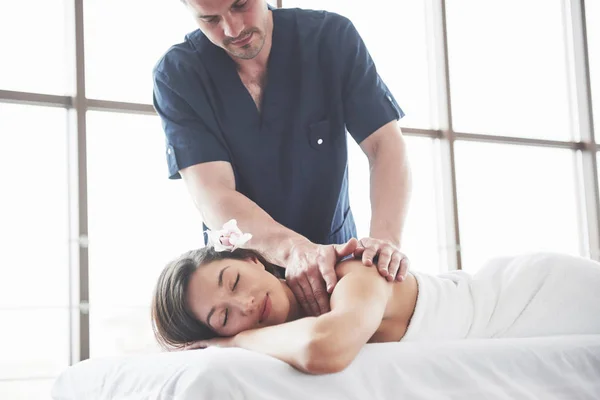 Beautiful woman lying on massage table in Spa