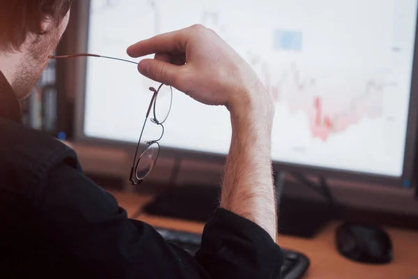 Analyzing Data Close Young Businessman Who Holds Glasses Looks Gff — Stock Photo, Image