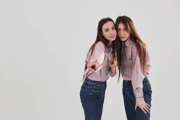 Looking Straight Camera Showing Gestures Two Sisters Twins Standing Posing — 스톡 사진