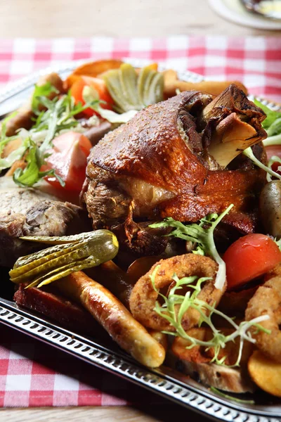 Sliced meat with different greens — Stock Photo, Image