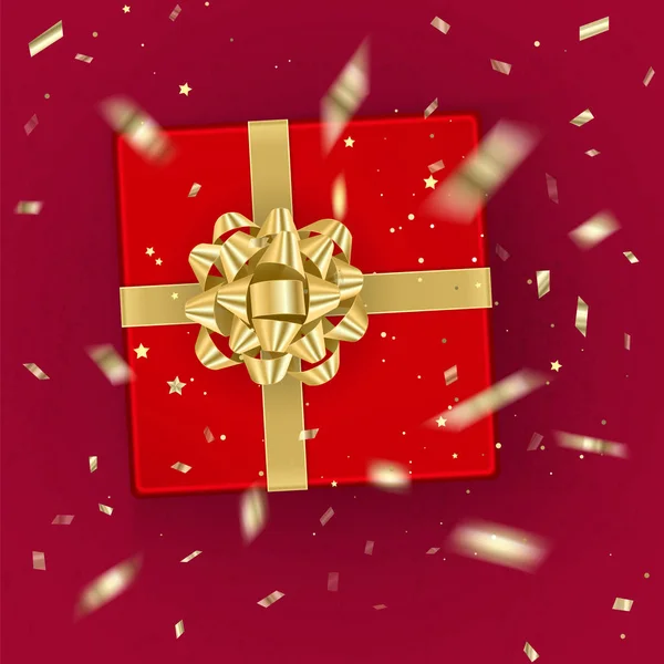 En realistisk röd presentbox dekorerad med en guld båge, ovanifrån. Vektorillustration — Stock vektor