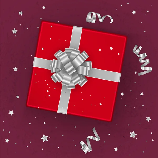 Une boîte cadeau rouge réaliste décorée d'un arc en argent, vue sur le dessus. Illustration vectorielle — Image vectorielle