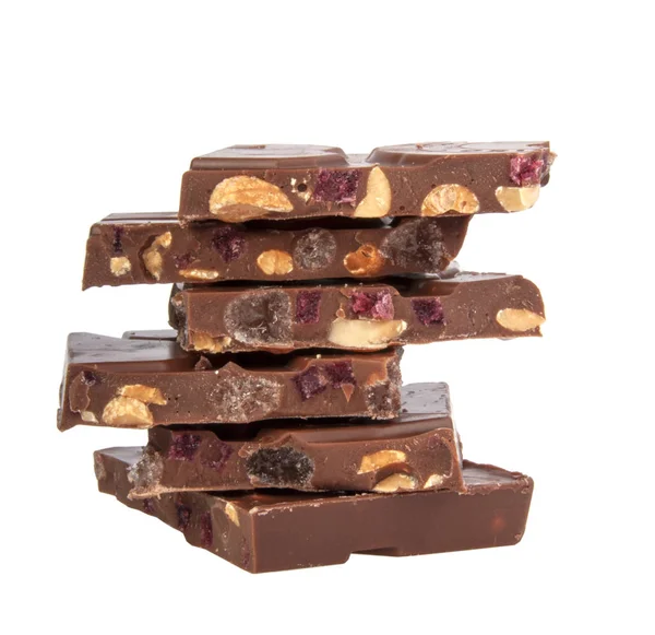 Milk chocolate with nuts and berries brocken isolated on the whi — 스톡 사진