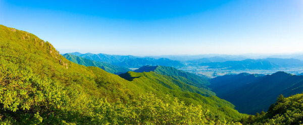 Panoramic view from Jirisan Mountain viewpont to valley below on a clear, spring day in South Korea. Horizontal