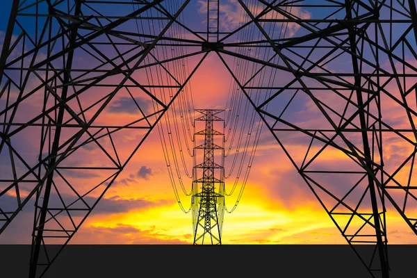 Silhouette image. High voltage tower and Colorful sky. This has — Stock Photo, Image