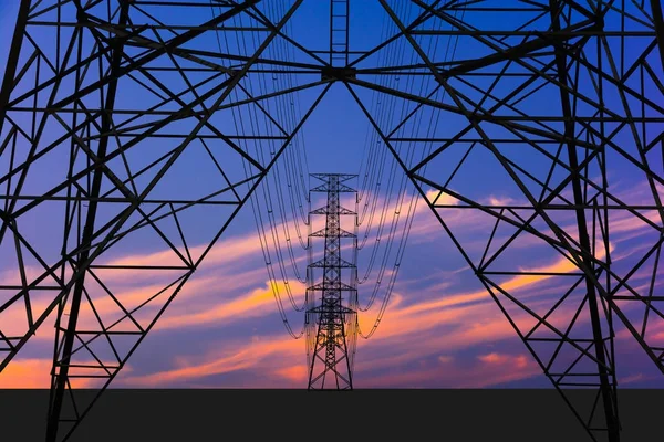 Silhouette image. High voltage tower and Colorful sky. — Stock Photo, Image