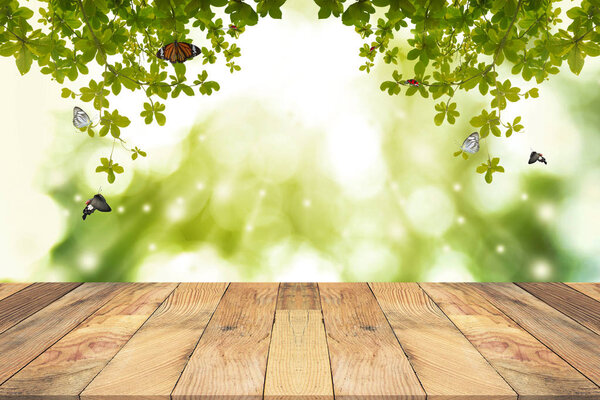 Brown Wooden table with green blurred background. Empty table for display product.