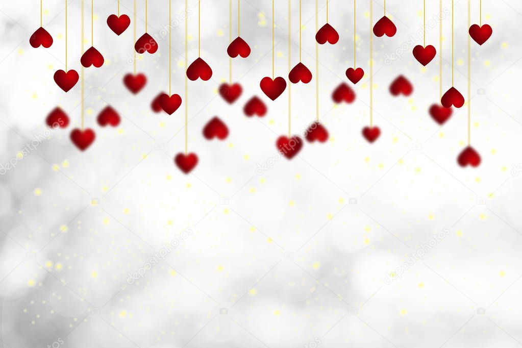 White blurry Background and Red Heart shape hanging.