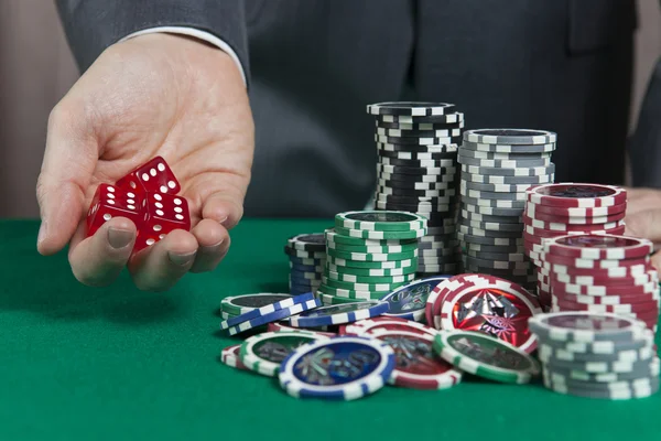 Hand holding three red dice — Stock Photo, Image