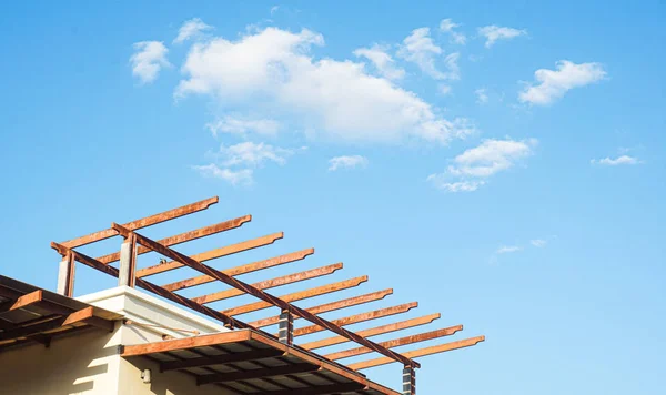 Closeup new stick built home under construction under blue sky — Stok fotoğraf