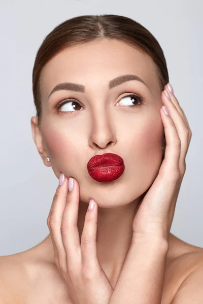 Beauty Woman Portrait with clean skin. Professional Makeup for Brunette. Beautiful Fashion Model Girl with red full lips. Perfect Skin Contouring Make up.