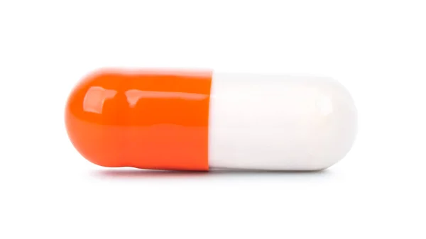 Orange-vit kapsel isolerad — Stockfoto