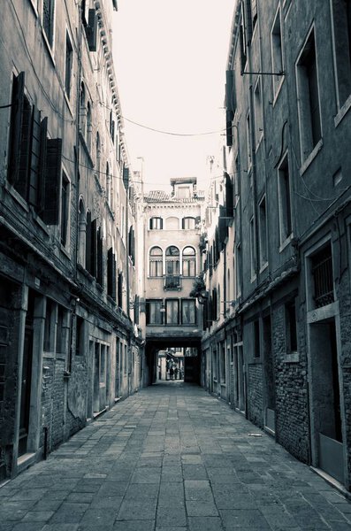 An empty alley somewhere in the city of Venice, Italy.