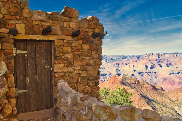 A historic southwest style building on the edge of the Grand Canyon.