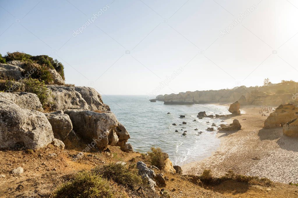 Cliffs with empty beach in Algarve at south of Portugal