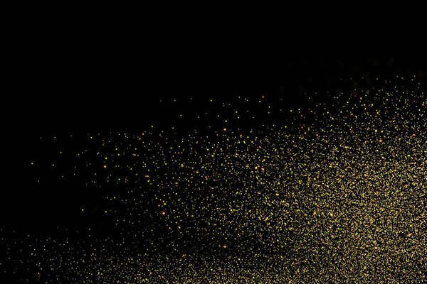 Gold glitter isolated on black background. Festive overlay texture. Golden confetti explosion