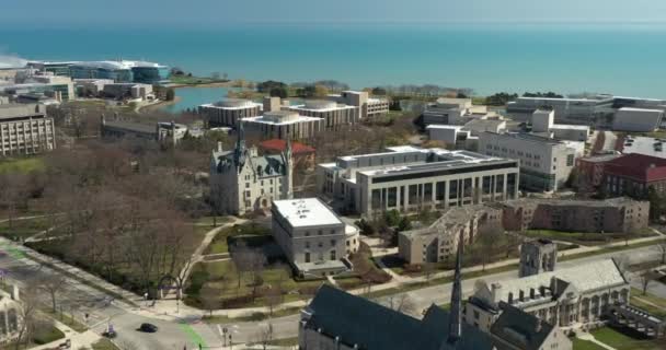 EVANSTON, IL - APRIL 3, 2020: On a normally busy school day, an aerial view shows the campus of Northwestern University shut down due to the COVID-19 pandemic. — Stock Video