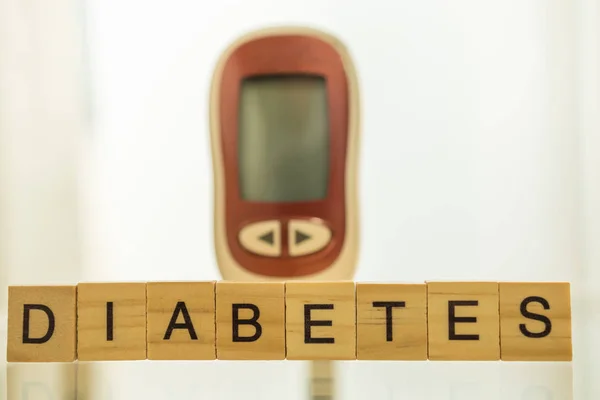 Close up of wooden letters block wording and Glucose meter as ba — 스톡 사진