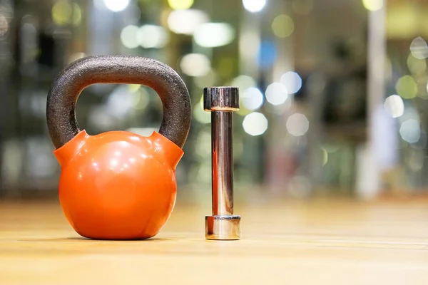 Colorful kettlebells in gym