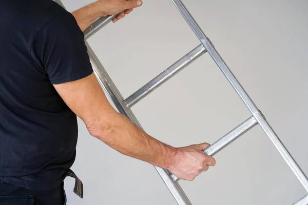 Worker with aluminum ladder — Stock Photo, Image
