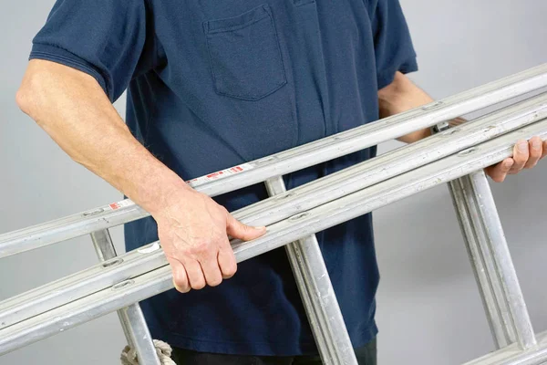 Worker with aluminum ladder — Stock Photo, Image