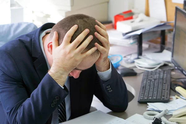 Businessman stressed out at work
