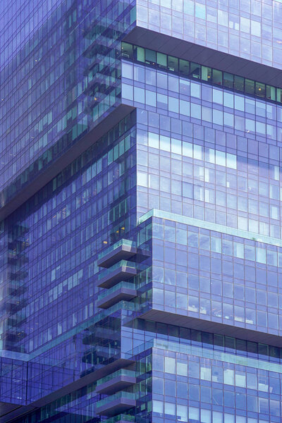 Glass blue square Windows of facade modern city business building skyscraper. Modern apartment buildings in new neighborhood. Windows of a building, texture. Tel Aviv. Israel.