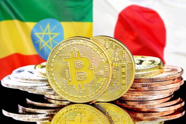 Etiyopya ve Japonya bayrak arkaplanındaki bitcoinler