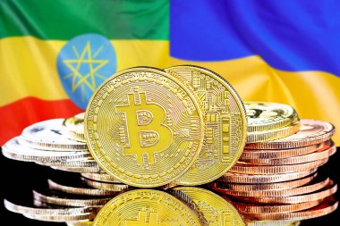 Etiyopya ve Ukrayna bayrak arkaplanındaki Bitcoinler