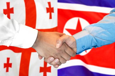 Gürcistan ve Kuzey Kore bayrak geçmişi üzerine el sıkışma.