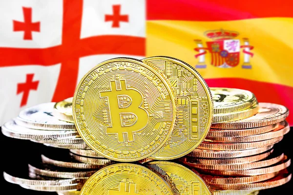 Bitcoins on Georgia and Spain flag background — Stock Photo, Image