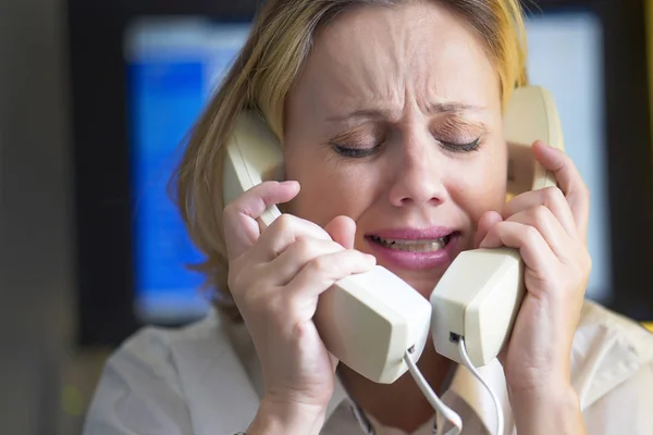 Composite image of businesswoman stressed out at work