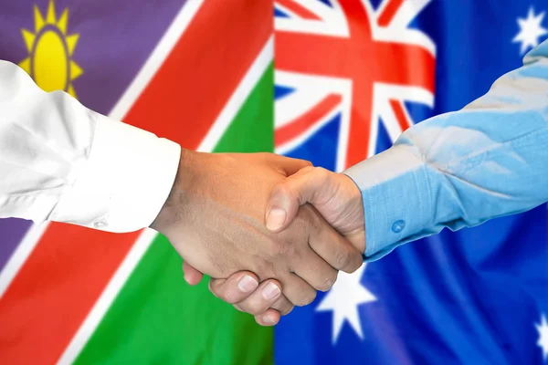 关于纳米比亚和澳大利亚国旗背景的握手. — 图库照片