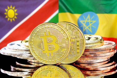 Namibya ve Etiyopya bayrağı arkaplanındaki bitcoinler.