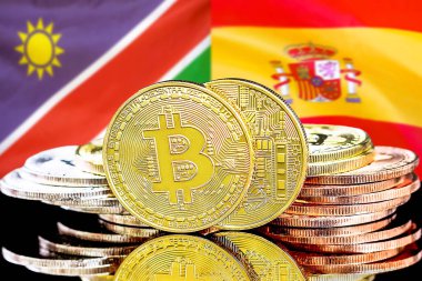 Namibya ve İspanya bayrak arkaplanındaki bitcoinler.