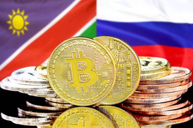 Namibya ve Rusya bayraklarında Bitcoins.